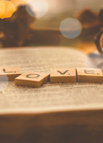 book with tiles spelling LOVE